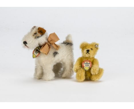 A Steiff post-war miniature teddy bear,  with golden mohair, black glass eyes, black stitched nose and mouth, swivel head, jo