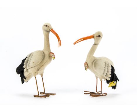Two post-war Steiff Adebar storks, Felt with metal feet and plastic beaks, buttons, yellow cloth and chest tags —6in. (15cm.)