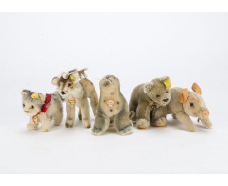 Five post-war Steiff animals, A Renny reindeer —6in. (15cm.) long, beige bear on all fours, Tabby kitten, Robby seal and runn