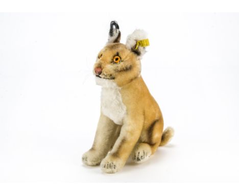 A rare post-war Steiff Luxy Lynx,  With button and yellow cloth tag, 1963 only —10in. (25cm.) high (slightly dusty)