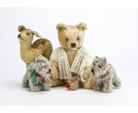 Steiff teddy bear and animals, A 1940s artificial silk deer —9in. (23cm.) high; a 1960s teddy bear with inserted shorter moha