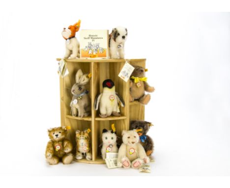 Historic Steiff Miniatures IV, A wooden display shelf with ten yellow tagged animals and bears comprising Petsy, Zotty, Dicky