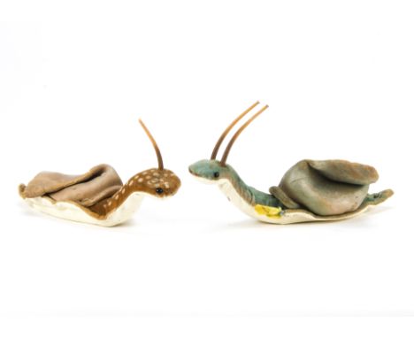 Two post-war Steiff Nelly Snails, One brown and one blue velvet, the blue with button and remains of yellow tag —7in. (17.5cm