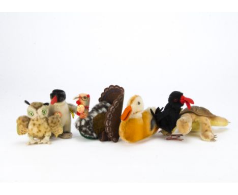 Steiff post-war birds and a tortoise, A Sutty turkey —4in. (10cm.) high, a Peggy penguin, a Hucky crow, a owl, duck and Slo, 