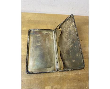 A 1934 London silver cigarette case with engine turned exterior, measures 14cm x 9cm, weighs 196 grammes