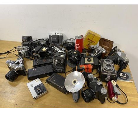 A large collection of photographic equipment including those by Kodak, Ross Enson, a Nettar Petri Crystar, a Coca Cola novelt
