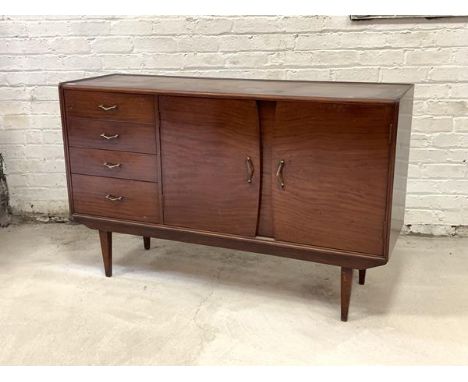 A Scottish mid century mahogany sideboard, fitted with four graduated drawers and two panelled cupboard doors enclosing a she