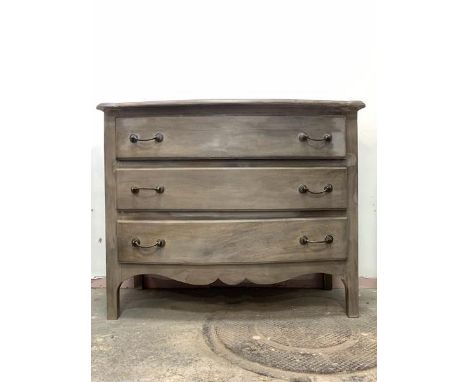 A French style grey painted bow front commode, fitted with three long drawers over a shaped apron, on bracket supports, H85cm