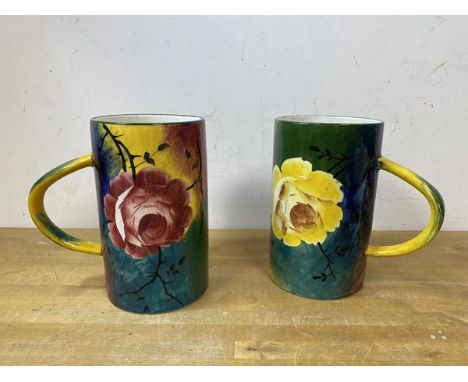 Two Wemyss large mugs, both in a polychrome floral pattern, handles to sides, one marked 213 to base, the other marked 214, m