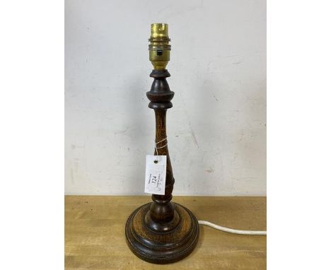 An oak candlestick style table lamp, measures 37cm to top of lampholder