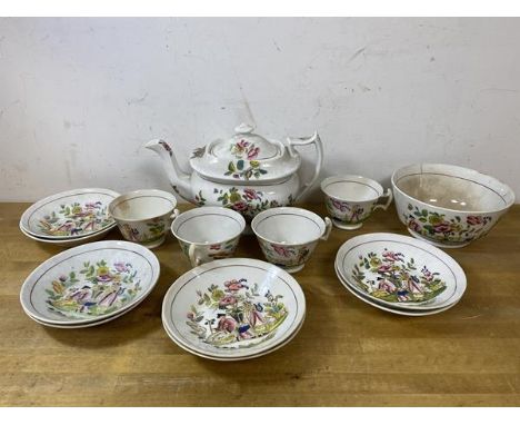 A 19thc 14pc teaset with teapot, measures 15cm high, four teacups, eight saucers, a bowl, all with Chinoiserie decoration, a/