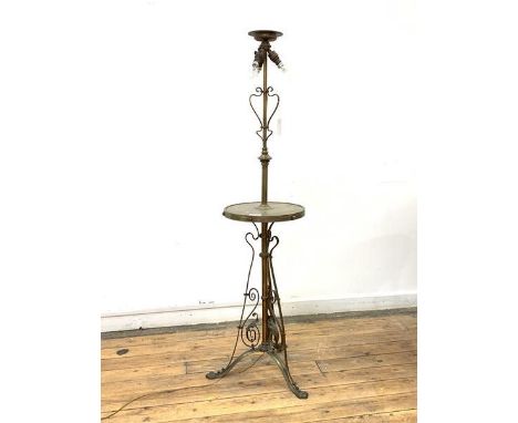 An Edwardian brass three branch standard light, with scrolled decoration, raised on triple splay supports, H152cm