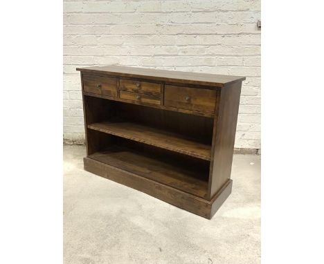 Laura Ashley, a hardwood side cabinet, fitted with four drawers over an open shelf, raised on a plinth base, H80cm, W110cm, D