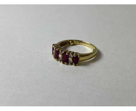 A ruby and diamond ring marked 18k, size K, weighs 3.45 grammes