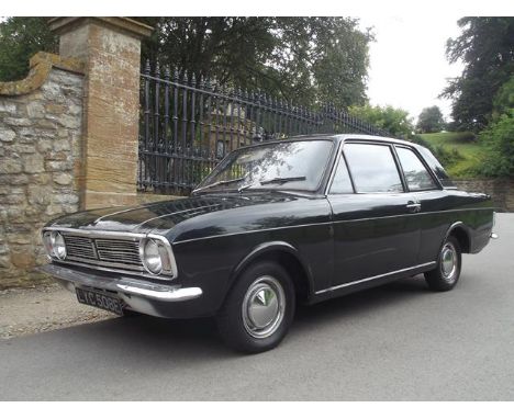 A 1967 Ford Cortina MkII DeLuxe two door saloon registration number LYC 508E, dark green. The reps favourite first saw the li