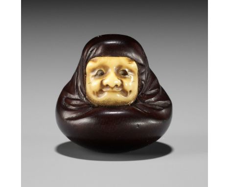 IPPOSAI: AN AMUSING INLAID IVORY AND WOOD KARAKURI (TRICK) NETSUKE OF A DARUMA DOLLBy Ipposai Jitsumin, signed Ipposai 一宝齋Jap