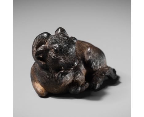 TAKUSAI: A SUPERB EBONY NETSUKE OF A GOATBy Tatekawa Takusai (1817-1887), signed Takusai 啄齋Japan, Suwa, Shinano Province, mid