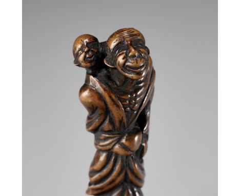 AN OLD EDO SCHOOL WOOD NETSUKE OF AN OLD MAN WITH CHILDUnsignedJapan, Edo (Tokyo), 18th century, Edo period (1615-1868)The sl