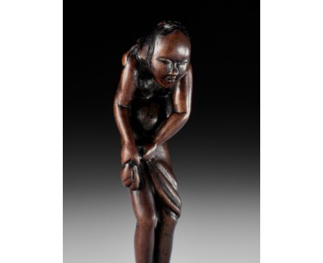 A TALL AND RARE WOOD NETSUKE OF AN AMA (DIVING GIRL)UnsignedJapan, 18th century, Edo period (1615-1868)A tall and pleasingly 