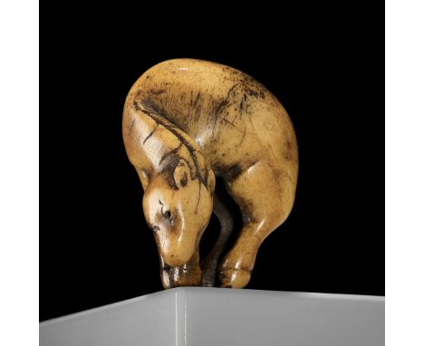 A RARE ANTLER NETSUKE OF A GRAZING HORSE, ATTRIBUTED TO TSUNEMASAAttributed to Tsunemasa, unsignedJapan, Kyoto, early to mid-