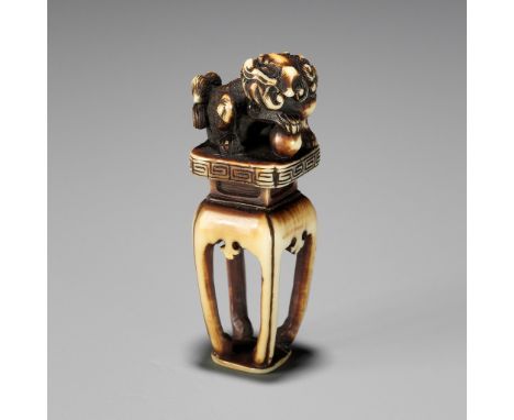 AN IVORY SEAL-TYPE (INGYO) NETSUKE OF A SHISHI, ATTRIBUTED TO ANRAKUAttributed to Shukosai Anraku, unsignedJapan, Osaka, seco