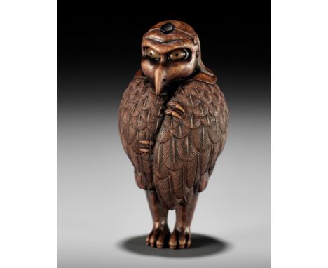 VADYM PYVOVAR: A BOXWOOD NETSUKE OF A FREEZING KARASU TENGUBy Vadym Pyvovar, signed with the artist's initialsUkraine, 2023A 