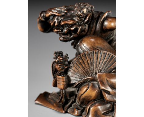 HOKUREI: AN AMUSING WOOD NETSUKE DEPICTING OKAME AND AN ONIBy Hokurei (Hokuryu), signed Hokurei 北嶺Japan, Meiji period (1868-1