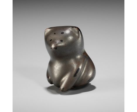 A CHARMING LACQUER NETSUKE OF A TOY DOGUnsignedJapan, Meiji period (1868-1912)Charmingly carved, the silver-lacquered dog sit