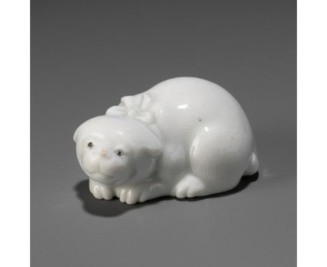 AN AMUSING HIRADO PORCELAIN NETSUKE OF A FAT PUPPYUnsignedJapan, 19th centuryFinely modeled as a recumbent and very fat puppy