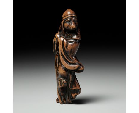 A LARGE AND RARE WOOD NETSUKE OF A FOX PRIEST (HAKUZOSU)UnsignedJapan, 18th century, Edo period (1615-1868)Standing enveloped