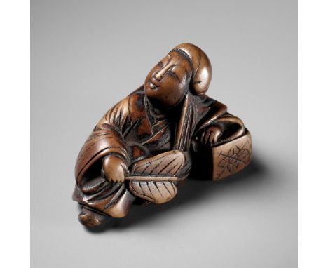 AN EARLY WOOD NETSUKE DEPICTING ROSEIUnsignedJapan, 18th century, Edo period (1615-1868)Depicting Rosei resting on his side a