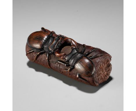 MICHAEL WEBB: A WOOD NETSUKE WITH TWO FIGHTING STAG BEETLES, DATED 1987By Michael Webb (1934-2009), signed with artist's mono
