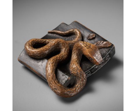 A RARE WOOD NETSUKE OF A SNAKE ON A ROOF TILEUnsignedJapan, 19th centuryNaturalistically carved, the twisting snake coiling a