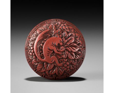 A RARE TSUISHU MANJU NETSUKE WITH SQUIRREL AND GRAPESUnsignedJapan, 18th-19th century, Edo period (1615-1868)The two-part man