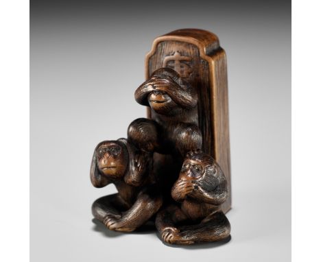 HOKYUDO ITSUMIN: A FINE WOOD NETSUKE OF A KOSHINTO STONE WITH THE THREE WISE MONKEYS (SAMBIKI SARU)By Hokyudo Itsumin, signed