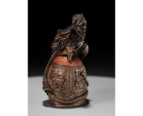 A SUPERB AND RARE WOOD AND LACQUER NETSUKE OF KIYOHIMEUnsignedJapan, 18th century, Edo period (1615-1868)Superbly carved as t