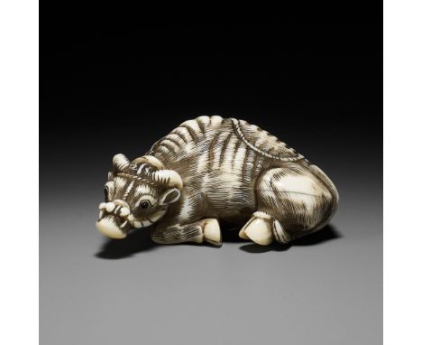 TOMOTADA: AN IVORY NETSUKE OF A RECUMBENT OXSigned Tomotada 友忠Japan, late 18th to early 19th century, Edo period (1615-1868)B