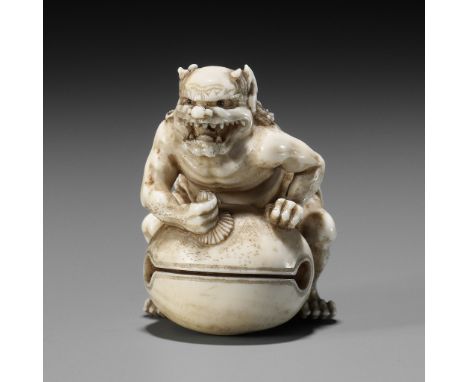 TOMOMASA: A FINE IVORY NETSUKE DEPICTING AN ONI POLISHING A MOKUGYOBy Tomomasa, signed Tomomasa 友正 to 刀Japan, Edo/Tokyo, seco