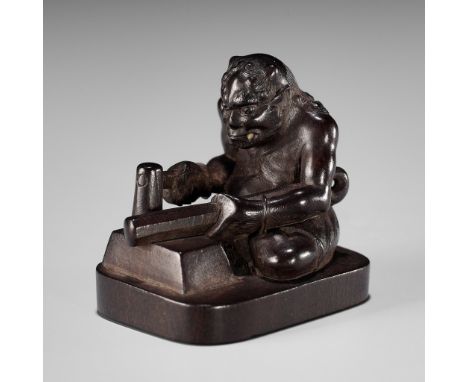 JUJO: A FINE WOOD NETSUKE OF AN ONI FORGING HIS KANABOBy Jujo (Toshinori), signed Jujo 壽乗 and kakihan Japan, Edo/Tokyo, secon