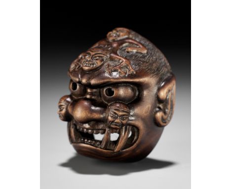 A FINE WOOD BUGAKU MASK NETSUKE OF GENKOJI KAMENUnsignedJapan, Edo (Tokyo), late 18th- early 19th century, Edo period (1615-1