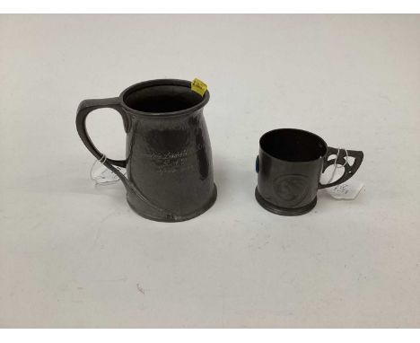 Art Nouveau Liberty Tudric pewter mug designed by Archibald Knox, applied with golfing motif, the glazed base etched '19th ho