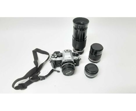 Nikon FA 35mm SLR camera with three Nikon Series E lenses - 28mm f/2,8, 50mm f/1.8 and 135mm f/2.8, and a 80-200mm zoom lens