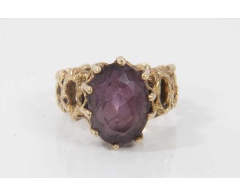 9ct gold amethyst cocktail ring in claw setting on pierced abstract design shank, size R½Condition report: Weight 8.4 grams