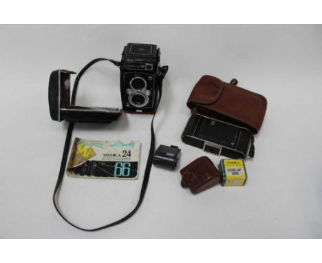 Yashica 24 twin lens reflex camera, together with a Kodak folding camera and accessories