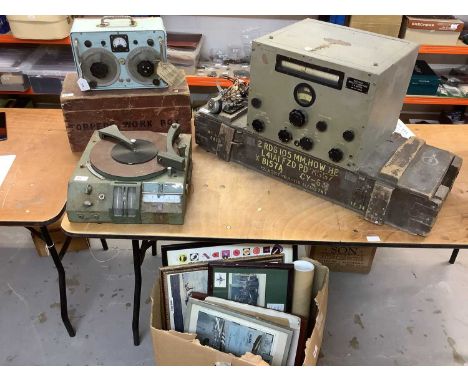 Group of assorted militaria to include two field radios / radio recievers, a collection of military pictures and prints, a wo