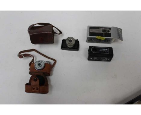 Three miniature camera, including a Halina Micro 110, a Mycro IIIa and an Ulca ST 1