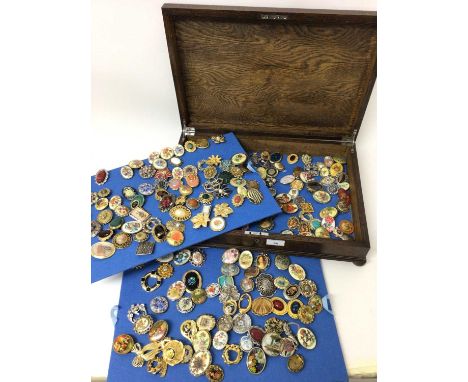 Large collection of vintage scarf clips within four oak canteen cases