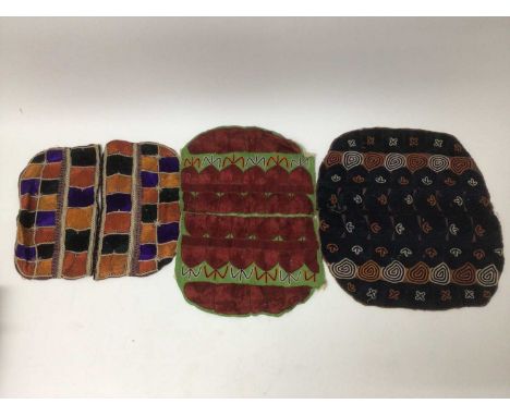 A selection of antique Pakistani embroidery items, vibrant silk floss darning stitches and chain stitches on hand woven cotto