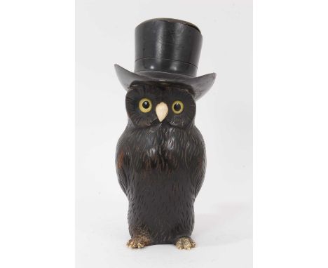 Early 20th century novelty carved owl spill holder, the hat with pewter liner, 22cm highCondition report: Reglued chip to the