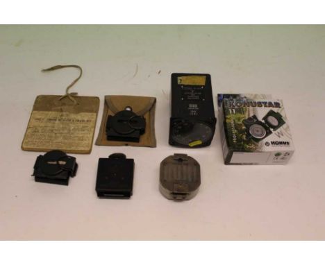 Second World War Magnetic Marching Compass MKI, together with an aircraft cockpit gauage and other compasses. 